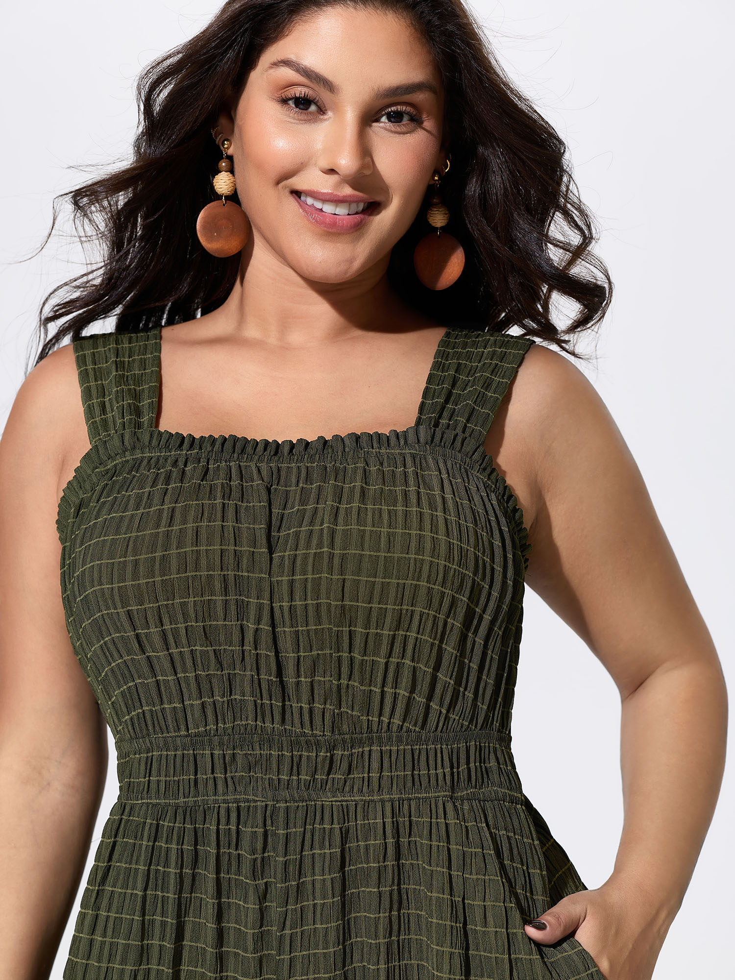 Side view of BloomChic Women's Plus Size Textured Wide Straps Shirred Waist Jumpsuit ArmyGreen Vacation 12/L
