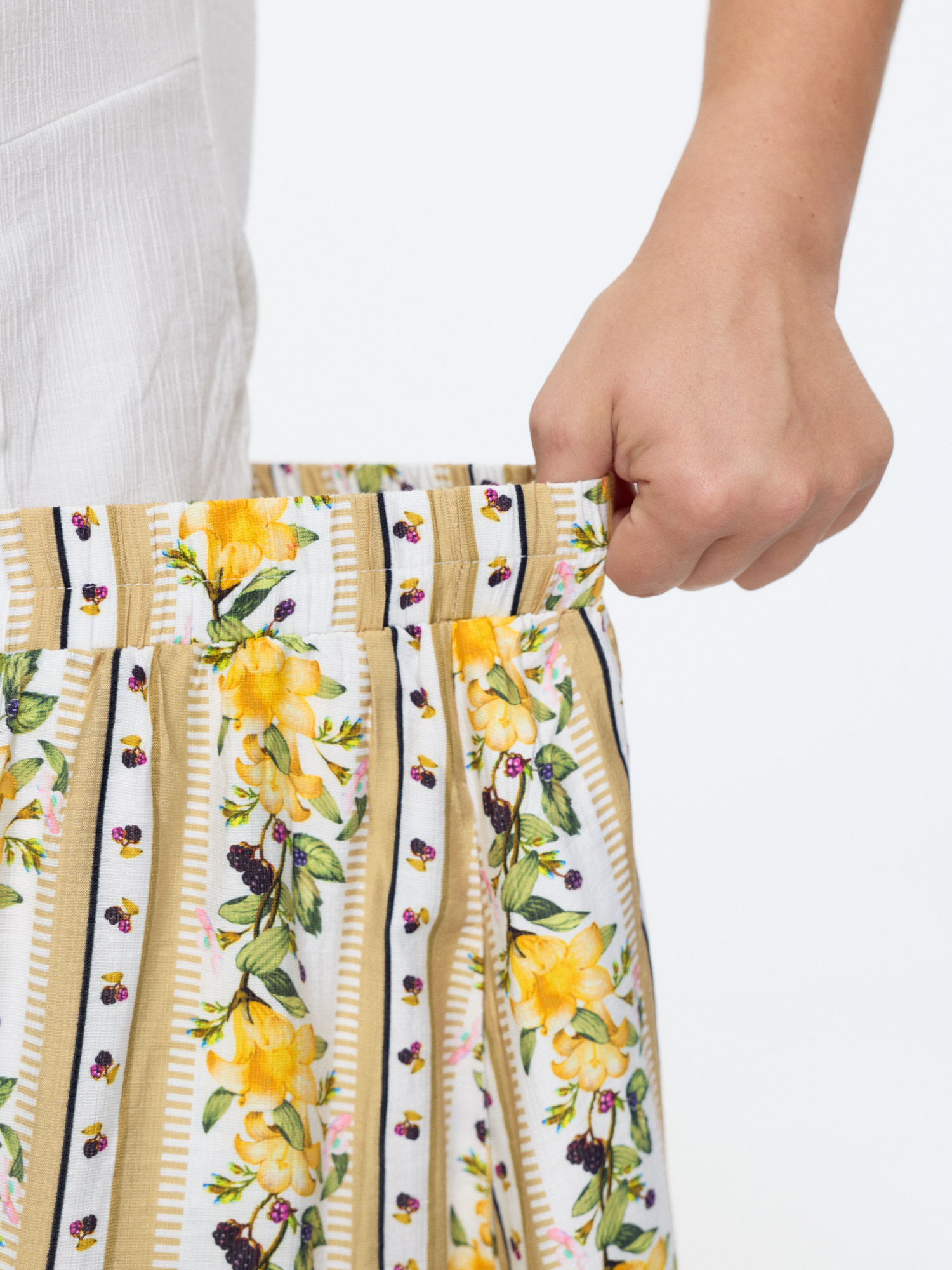 Side view of BloomChic Women's Plus Size Floral Striped Print Ruffled Hem Midi Skirt Multicolor Non Flared Elegant 26/4X