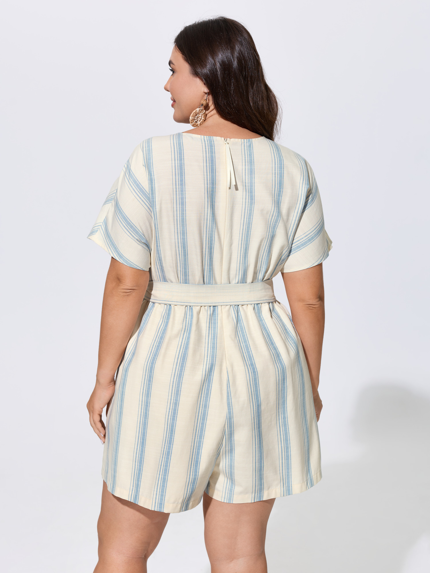 Side view of BloomChic Women's Plus Size Striped Print Stretchy Waist-Tie Romper LightBlue Vacation 12/L