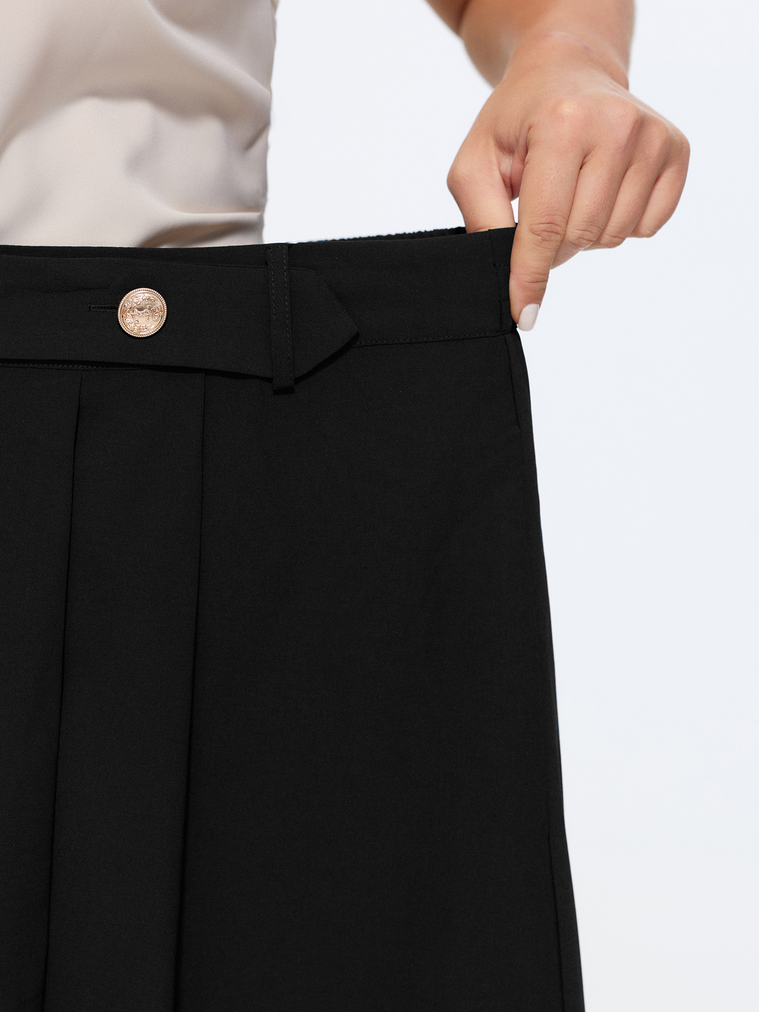 Side view of BloomChic Women's Plus Size Waist Beaded Pleated Flowy Maxi Skirt Black Wide Waistband Flared Office 14-16/1X