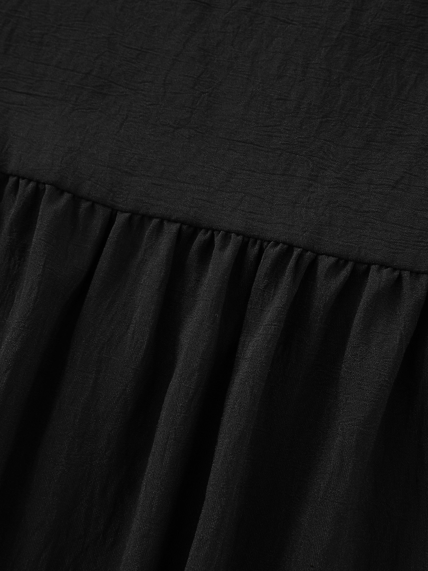 Side view of BloomChic Women's Plus Size Adjustable Drawstring Waist Plain Tiered Flowy Midi Skirt Black Non A-line Casual 30/6X
