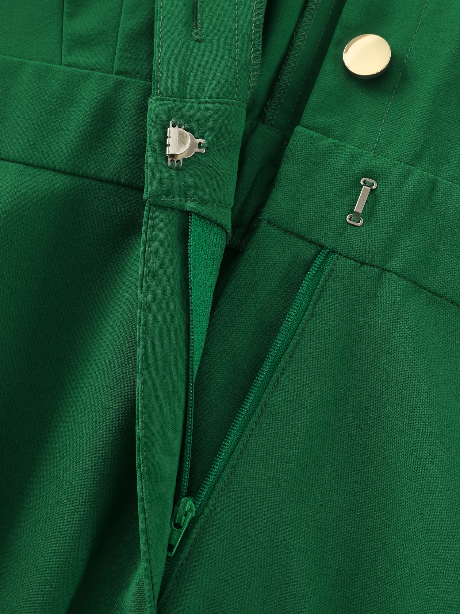 Side view of BloomChic Women's Plus Size Button Placket Pockets Wide-Leg Jumpsuit Emerald Office 10/M