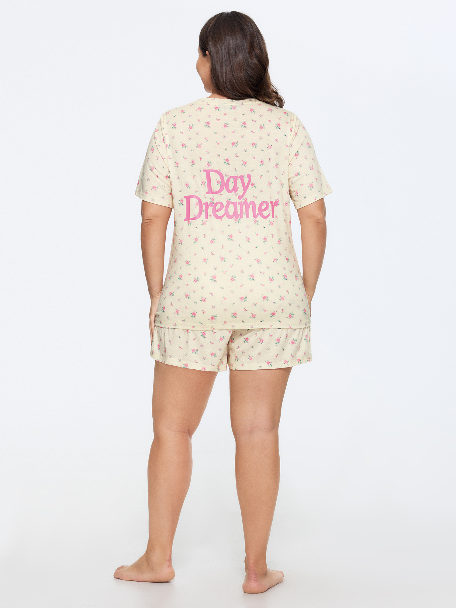 Side view of BloomChic Women's Plus Size Day Dreamer Stretchy Pajama Set Ivory Text 14-16/1X