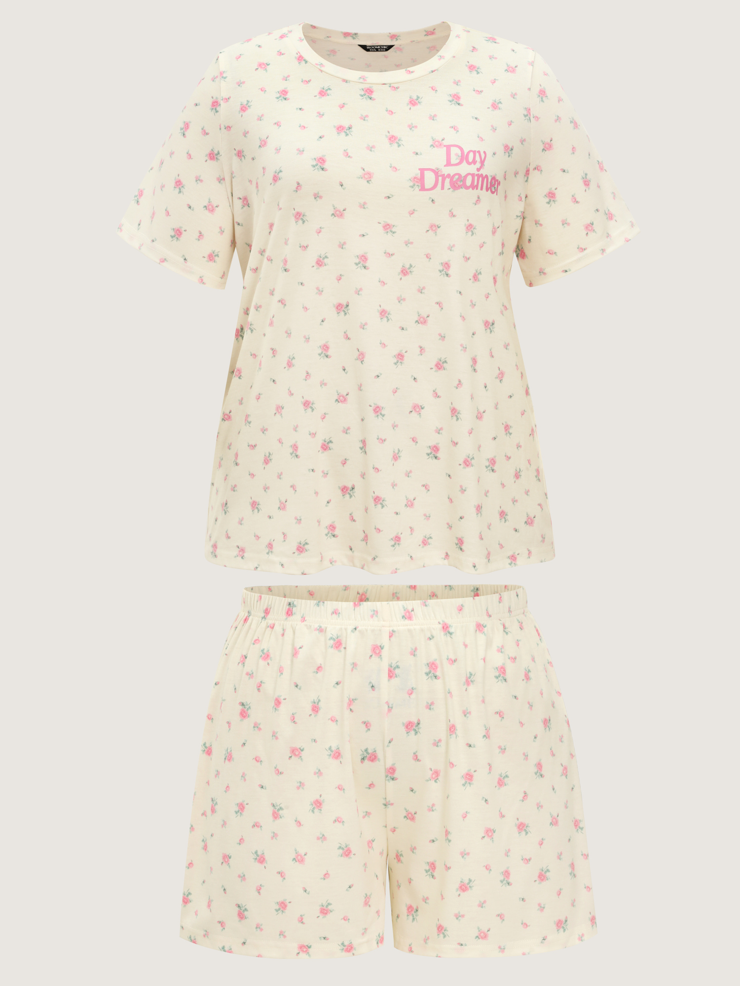 Side view of BloomChic Women's Plus Size Day Dreamer Stretchy Pajama Set Ivory Text 14-16/1X