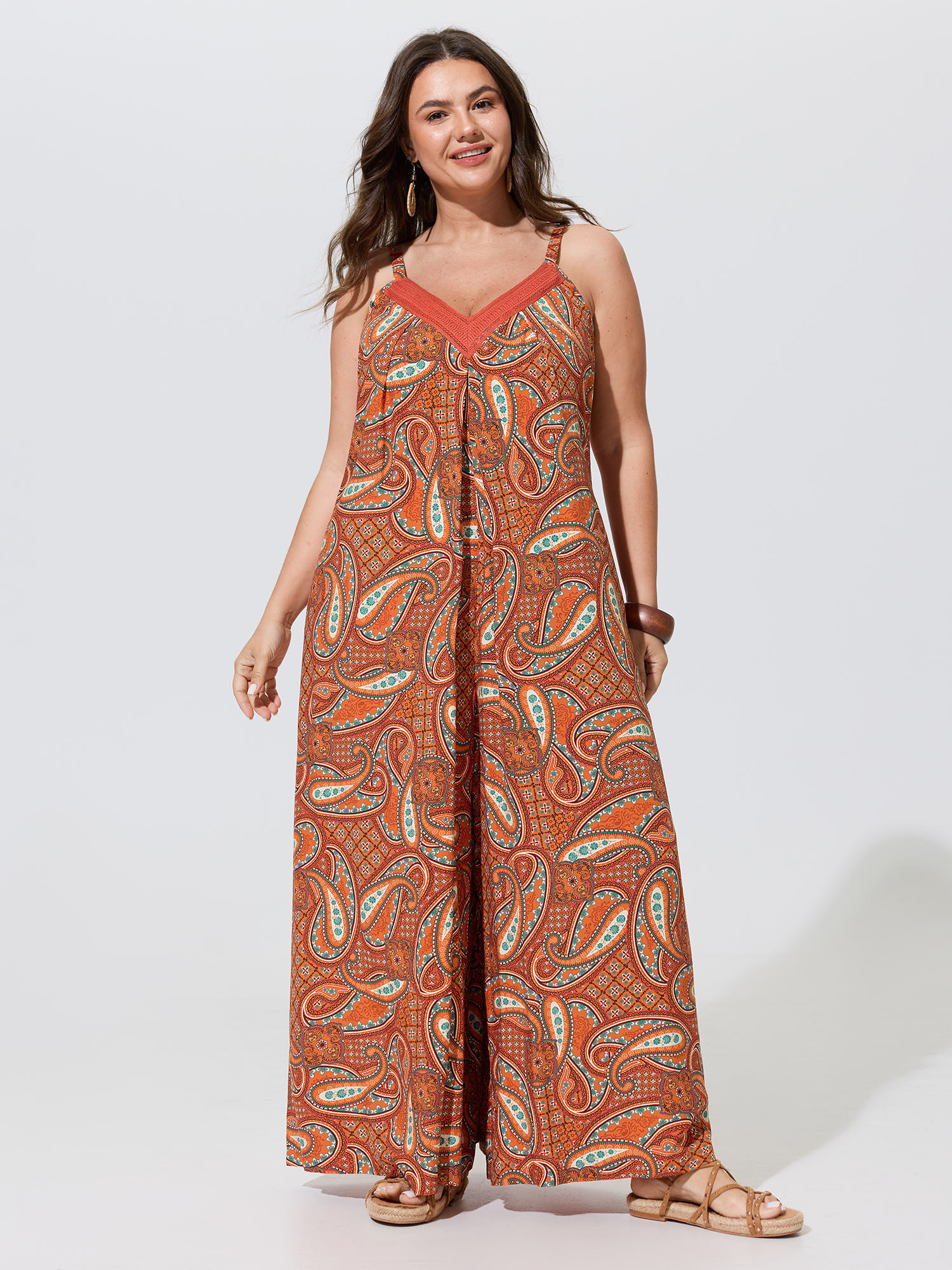Side view of BloomChic Women's Plus Size Paisley Print Backless Sleeveless Jumpsuit Brightorange Vacation Relaxed Fit 14-16/1X