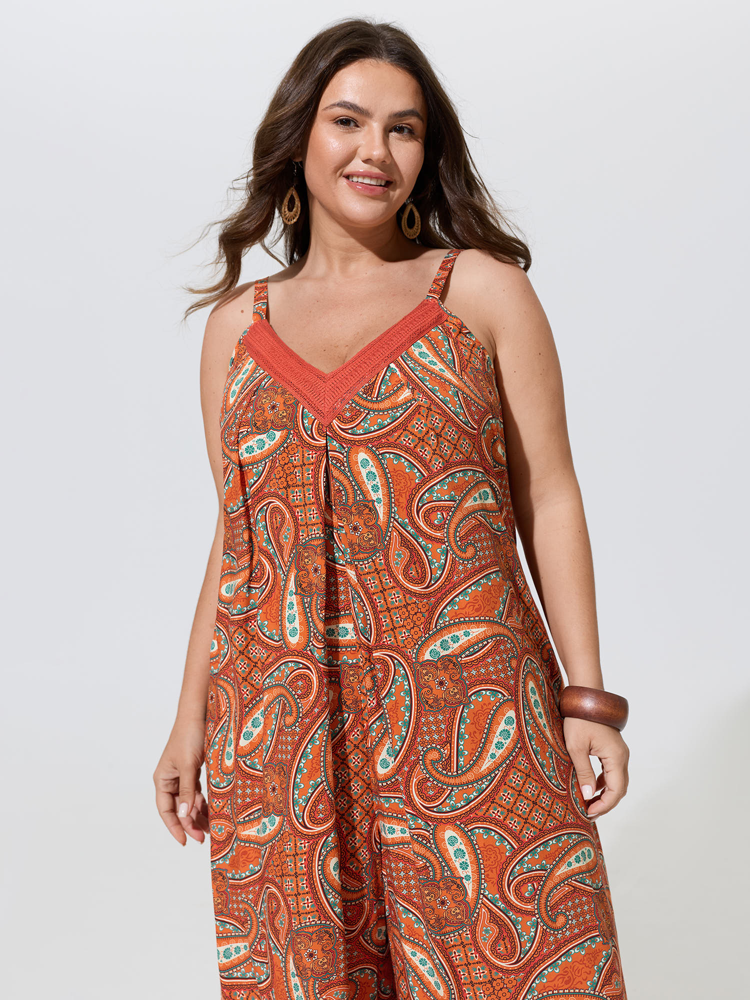 Side view of BloomChic Women's Plus Size Paisley Print Backless Sleeveless Jumpsuit Brightorange Vacation Relaxed Fit 14-16/1X