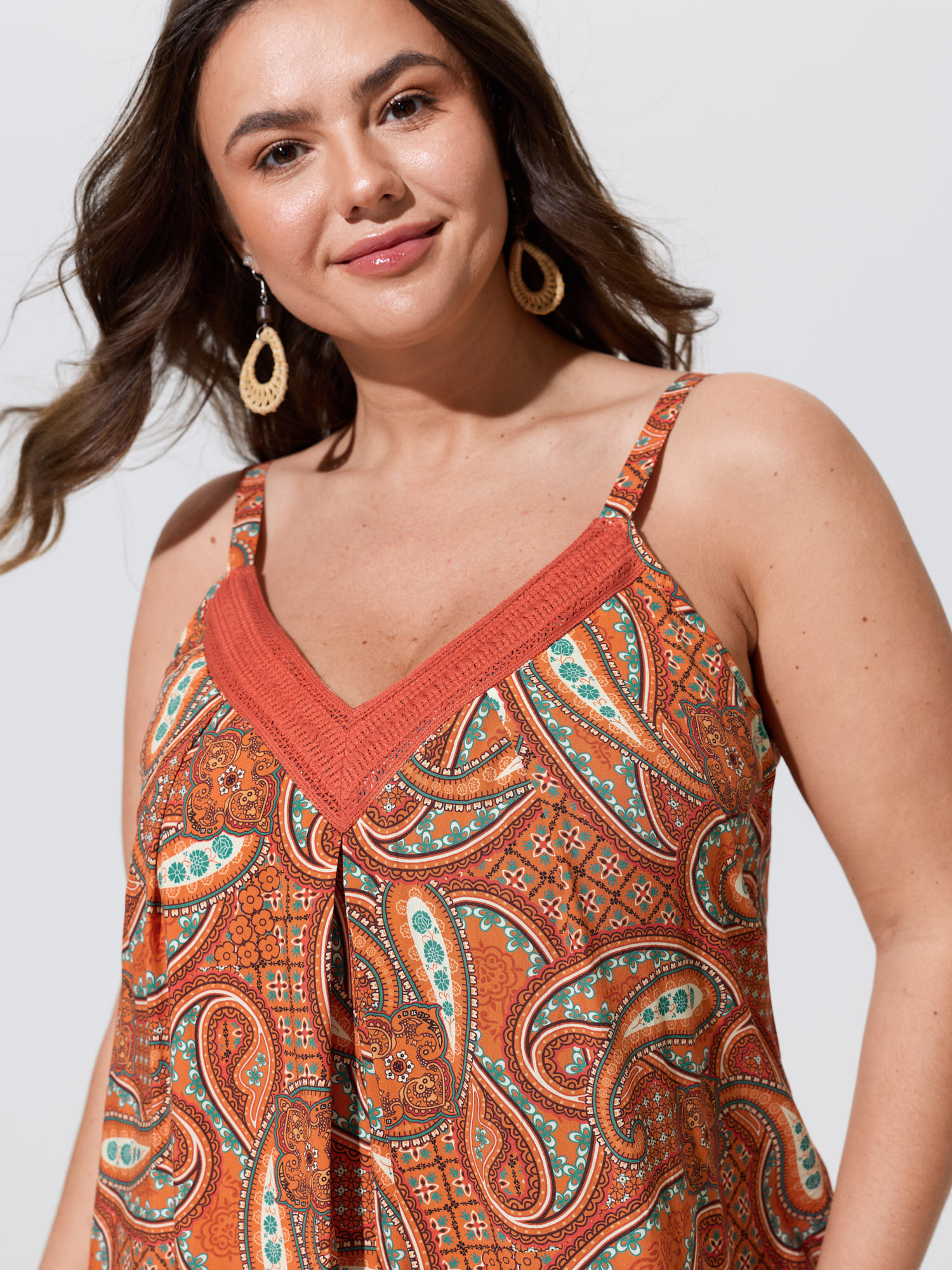 Side view of BloomChic Women's Plus Size Paisley Print Backless Sleeveless Jumpsuit Brightorange Vacation Relaxed Fit 14-16/1X