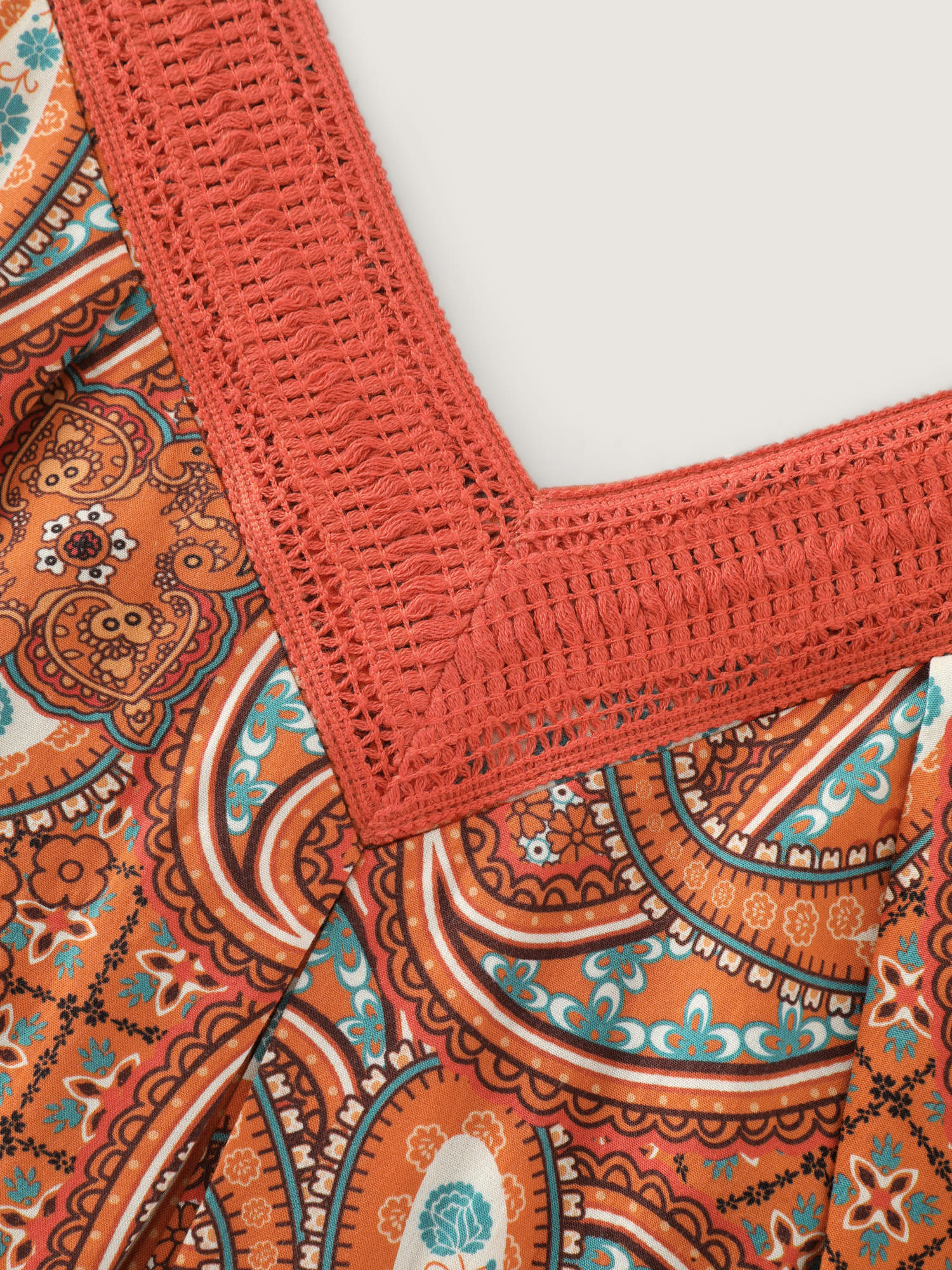 Side view of BloomChic Women's Plus Size Paisley Print Backless Sleeveless Jumpsuit Brightorange Vacation Relaxed Fit 14-16/1X