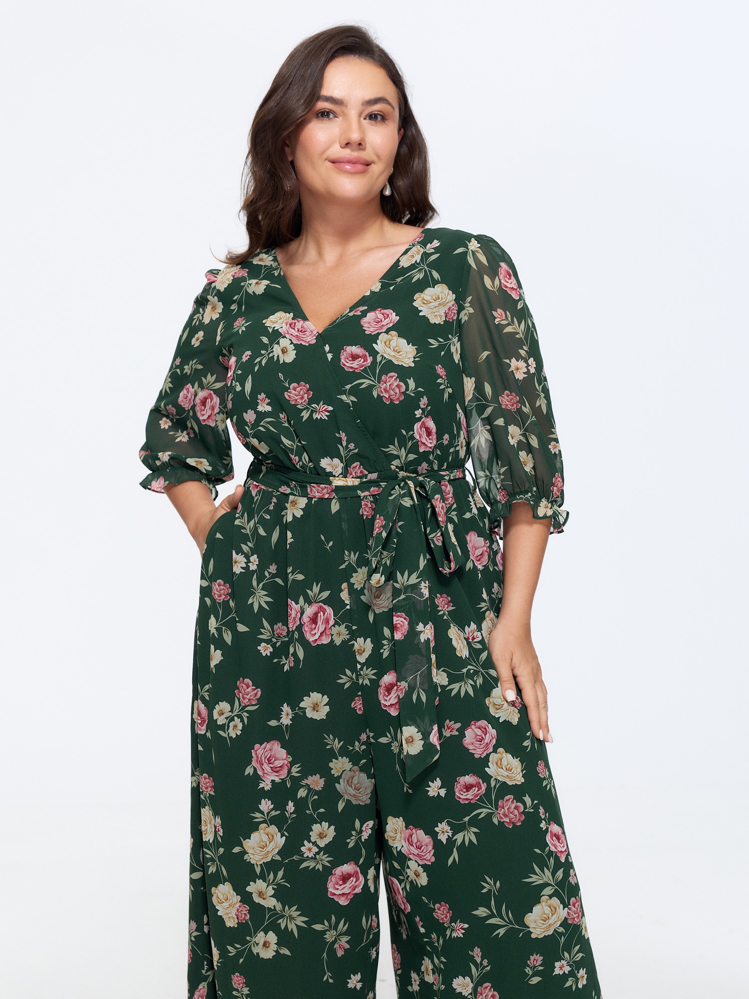 Side view of BloomChic Women's Plus Size Floral Print Stretchy Waist Drawstring Jumpsuit DarkGreen Elegant 30/6X