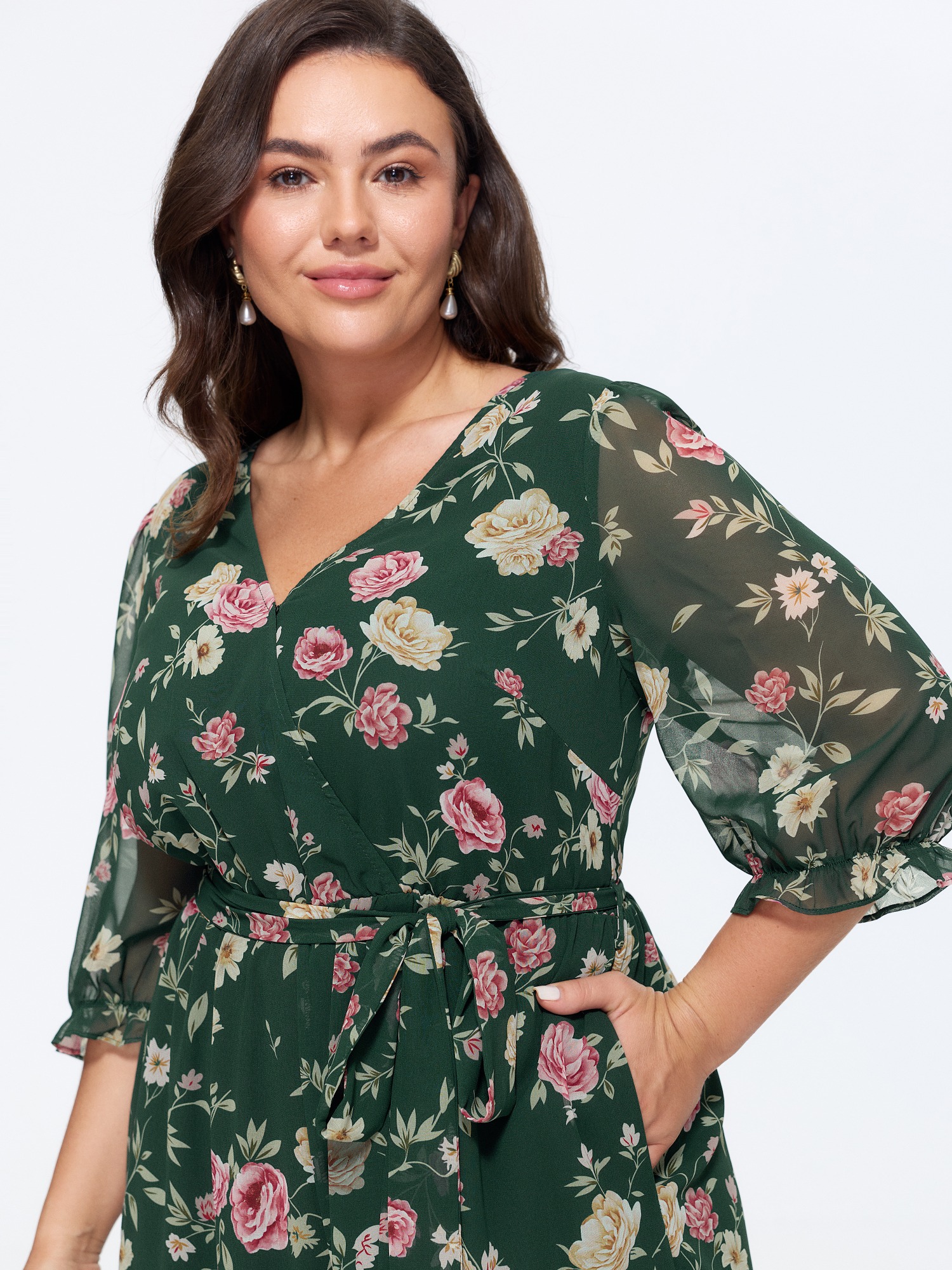 Side view of BloomChic Women's Plus Size Floral Print Stretchy Waist Drawstring Jumpsuit DarkGreen Elegant 30/6X
