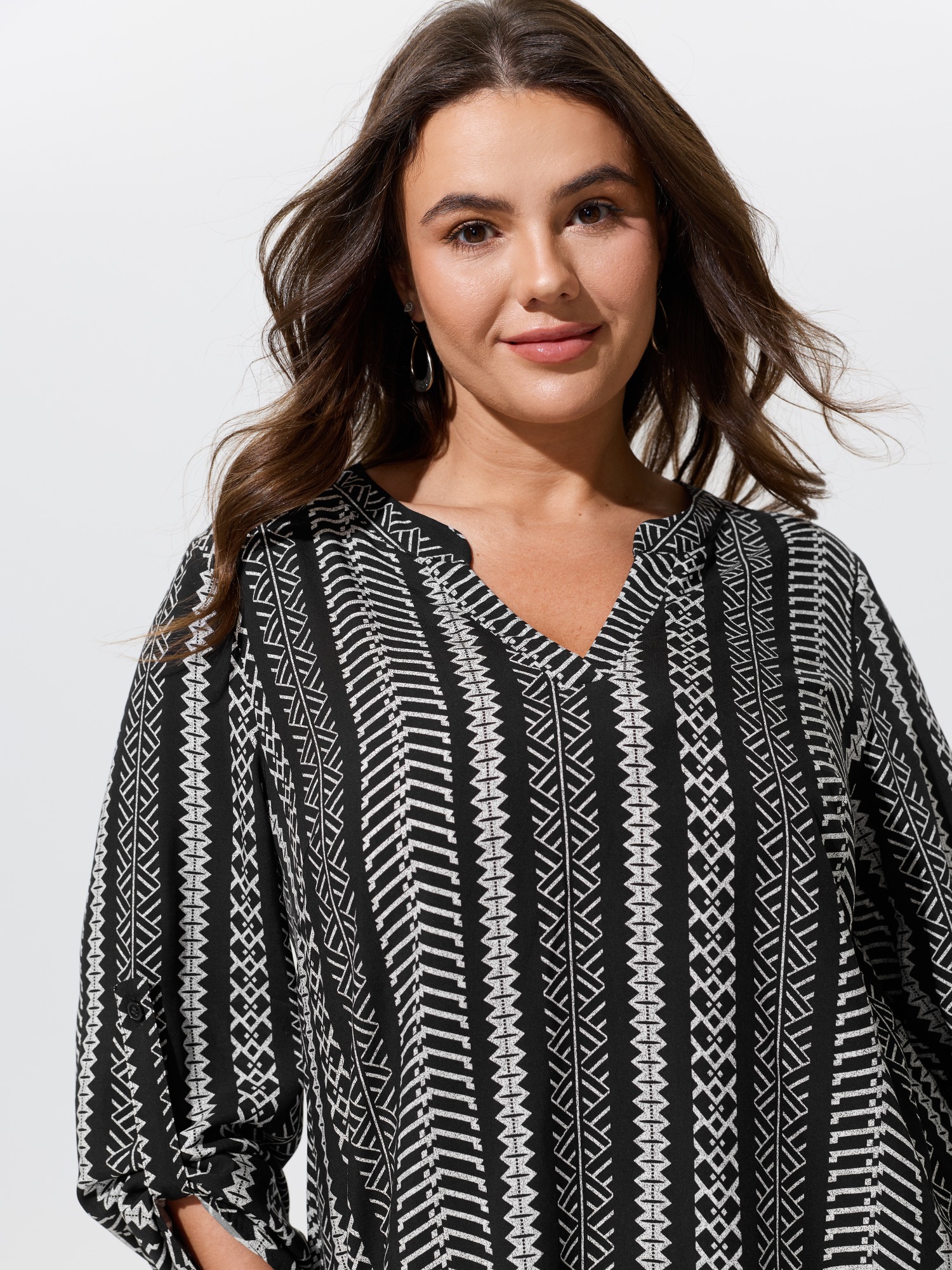 BloomChic Women's Plus Size Boho Geometric Print Roll‑Tab Sleeve Blouse Black Ethnic Floral Vacation 3/4 Sleeve V-Notch Neck 18-20/2X